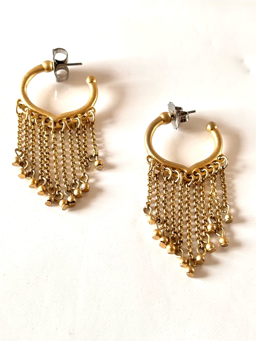 Lia Sophia Hoop earrings adorned with fringes of golden metal chains